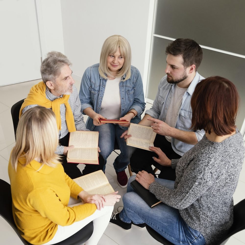 group-people-reading-books-therapy-session